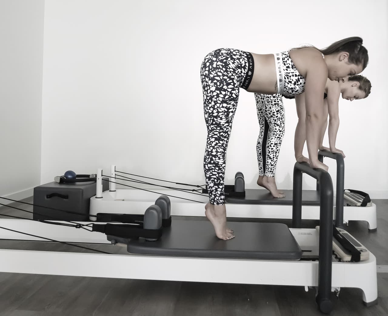 Reformer Pilates class in a calm studio